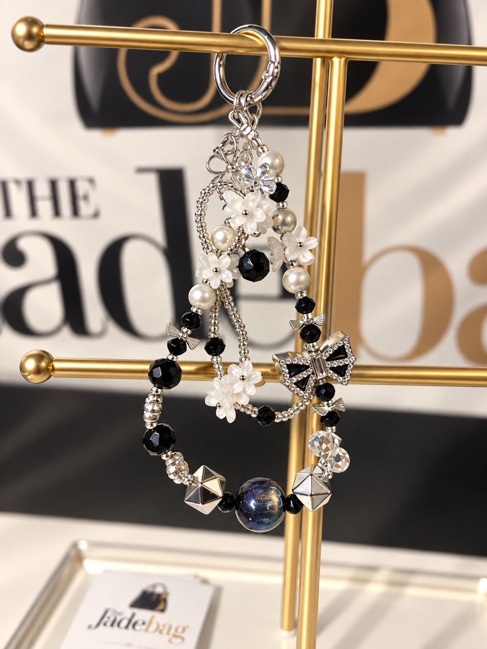 The JadeBags Black & White Bow Crystal Charm
