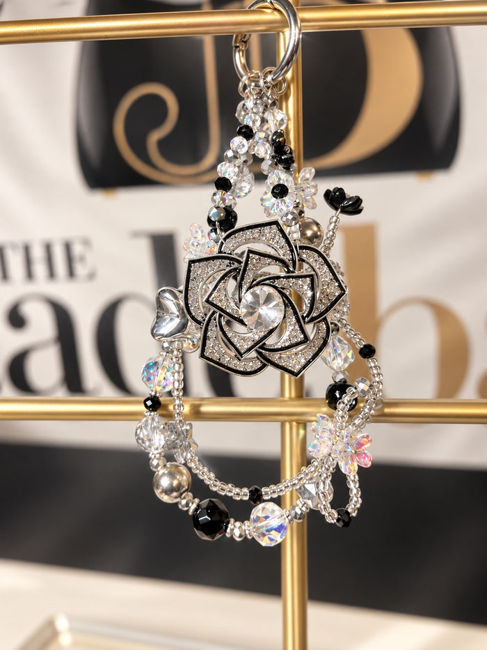 The JadeBags Black & Silver Floral Crystal Charm
