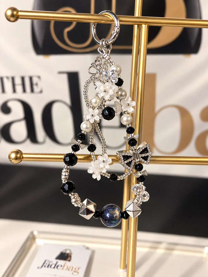 The JadeBags Black & White Bow Crystal Charm