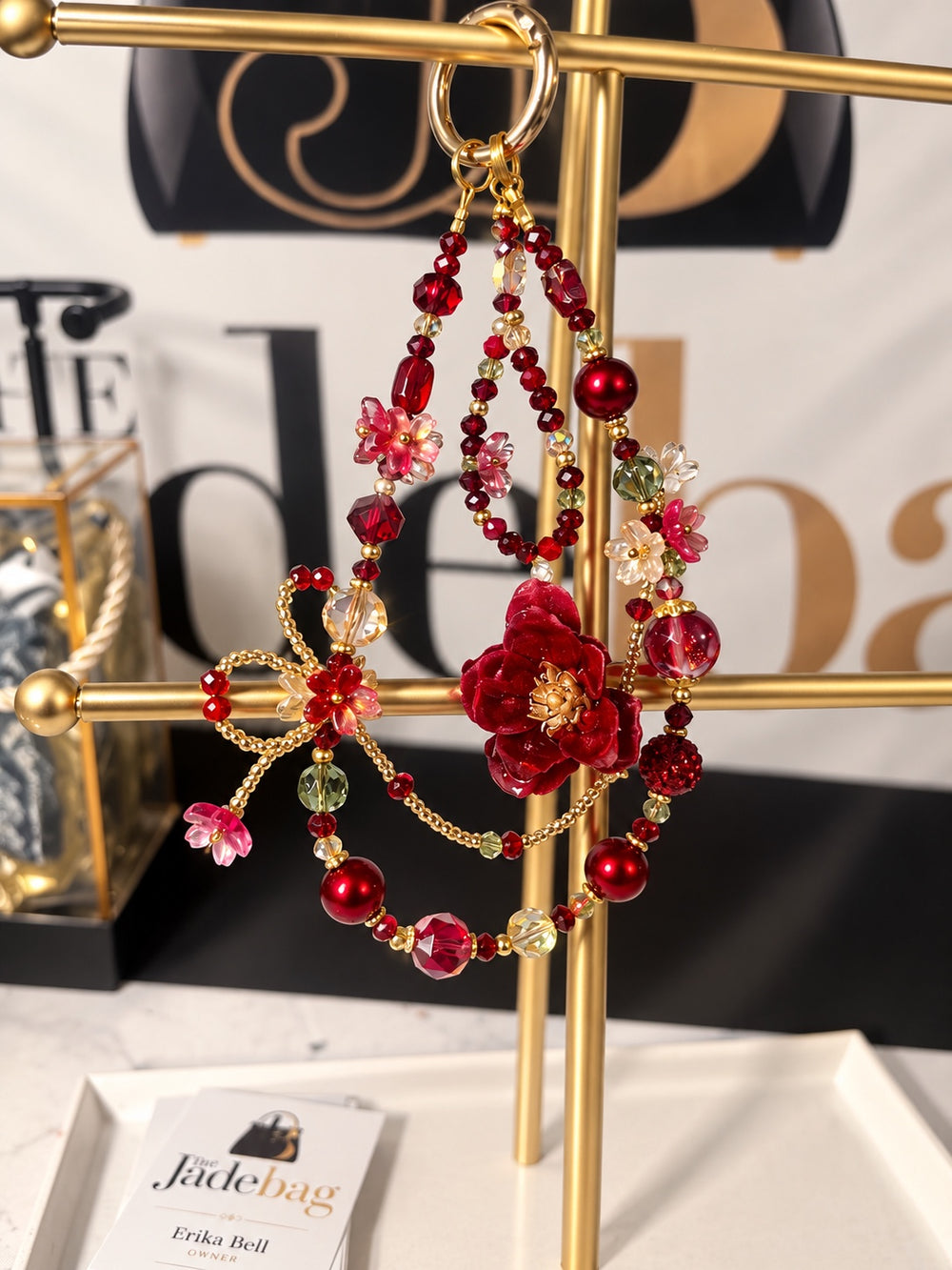 The JadeBags Red Floral Crystal Charm