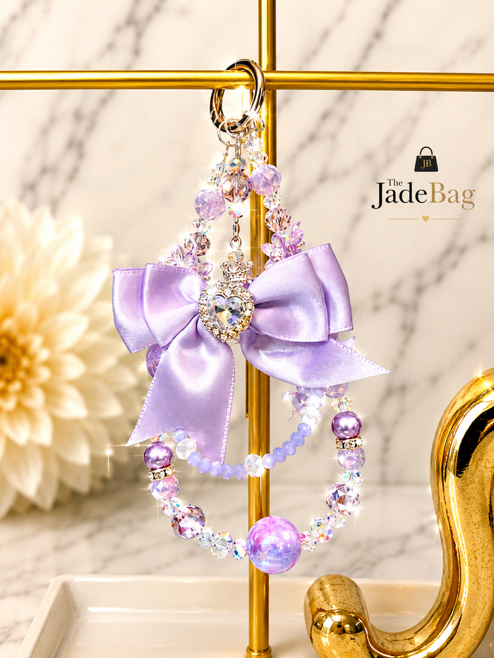 The JadeBags purple bow crystal charm